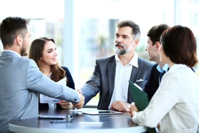 Business professionals shaking hands