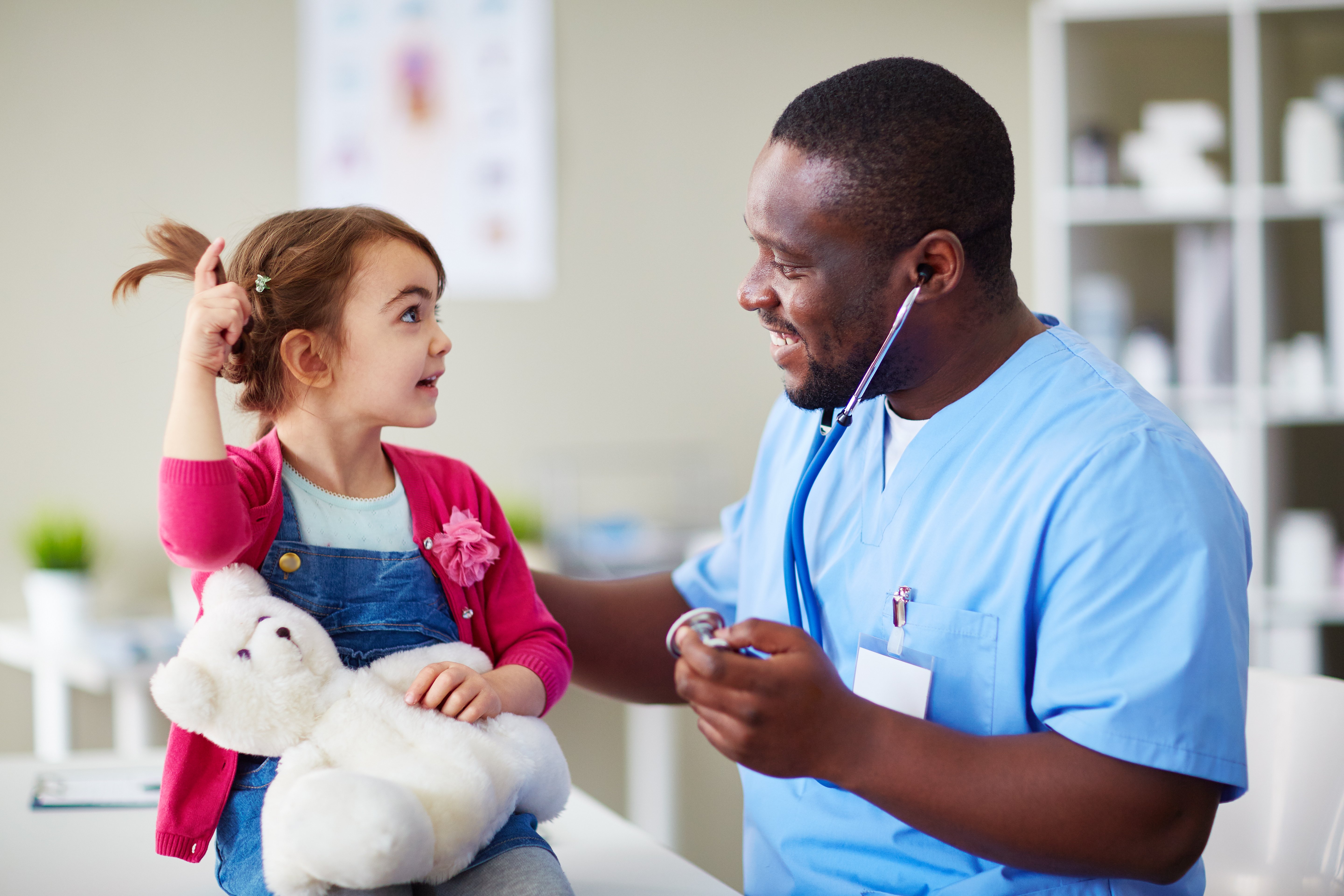 Pediatrician with a child